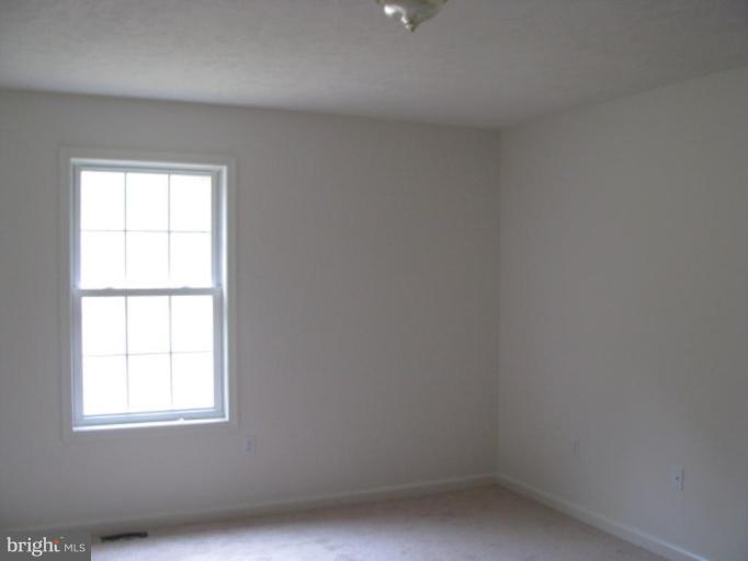 123 Martin Road Front Royal, VA 22630 - Photo 10 of 13 an empty room with a window