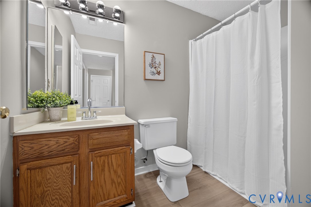 1559 Tree Ridge Road Henrico, VA 23231 - Photo 31 of 40 Wood-finish flooring and light gray walls create a