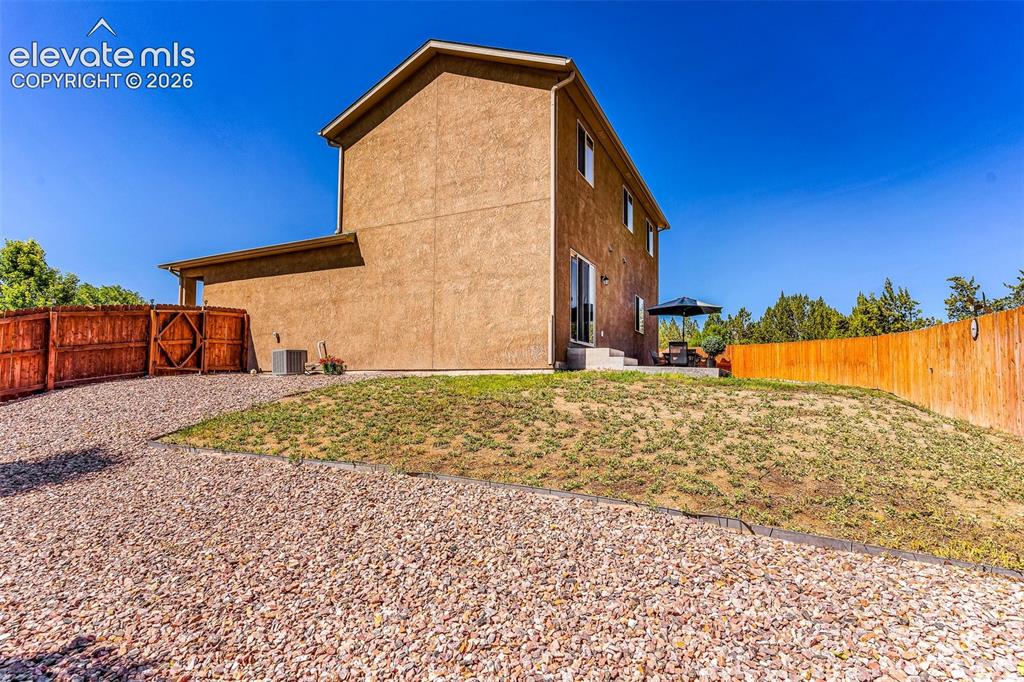 415 Empire Road Canon City, CO 81212 - Photo 38 of 40 a front view of a house with a yard