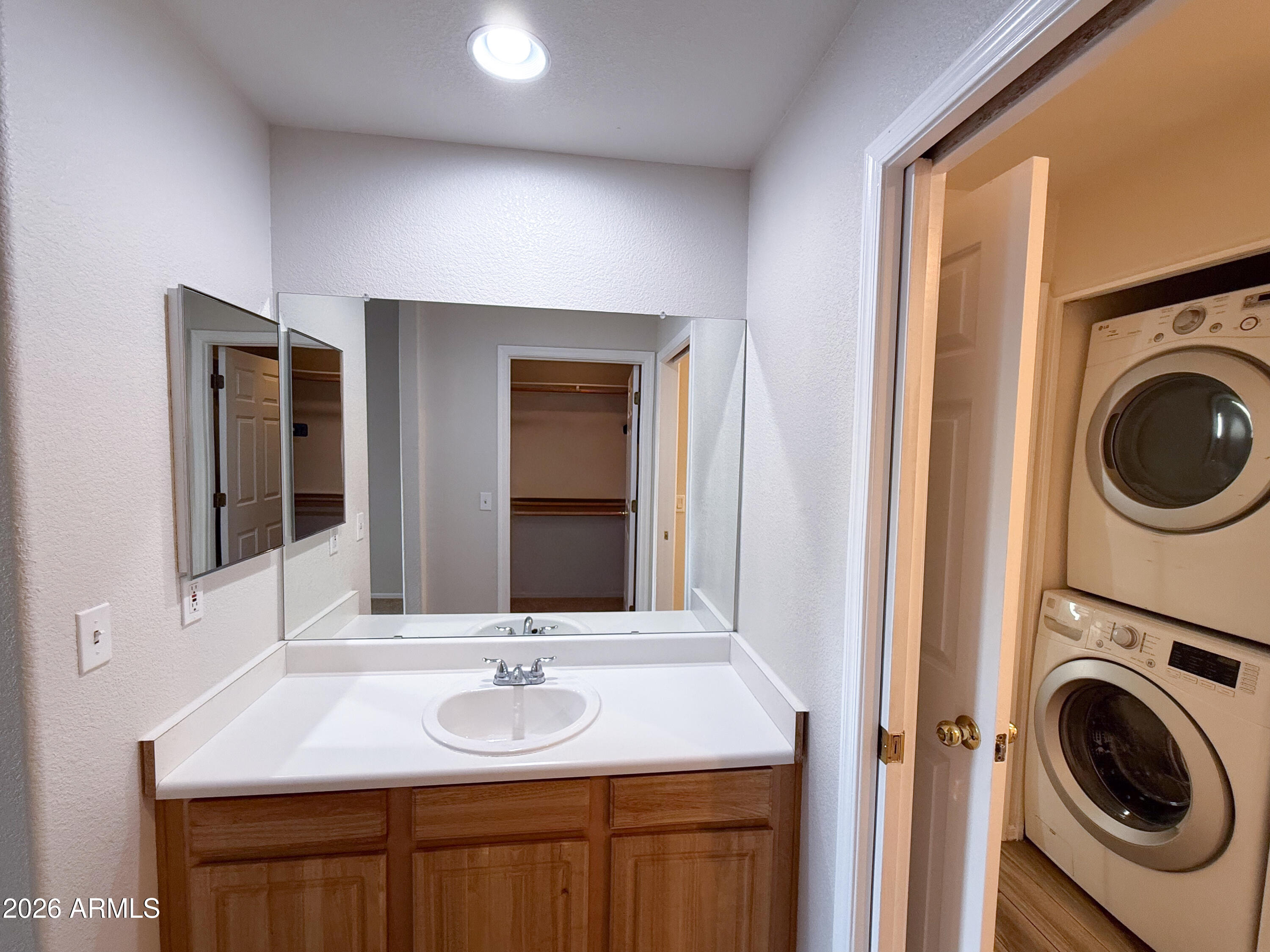 7101 West Beardsley Road, Unit 711 Glendale, AZ 85308 - Photo 19 of 33 a bathroom with a sink and a mirror