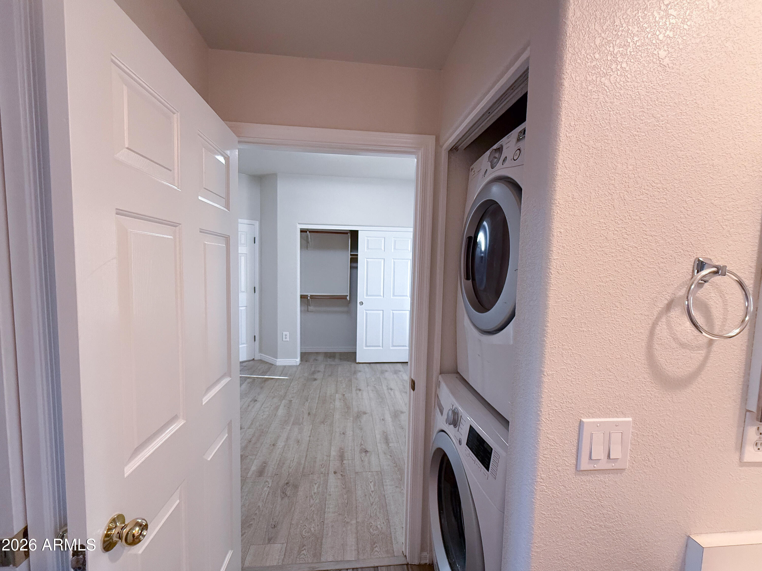 7101 West Beardsley Road, Unit 711 Glendale, AZ 85308 - Photo 23 of 33 a hallway with washer and dryer