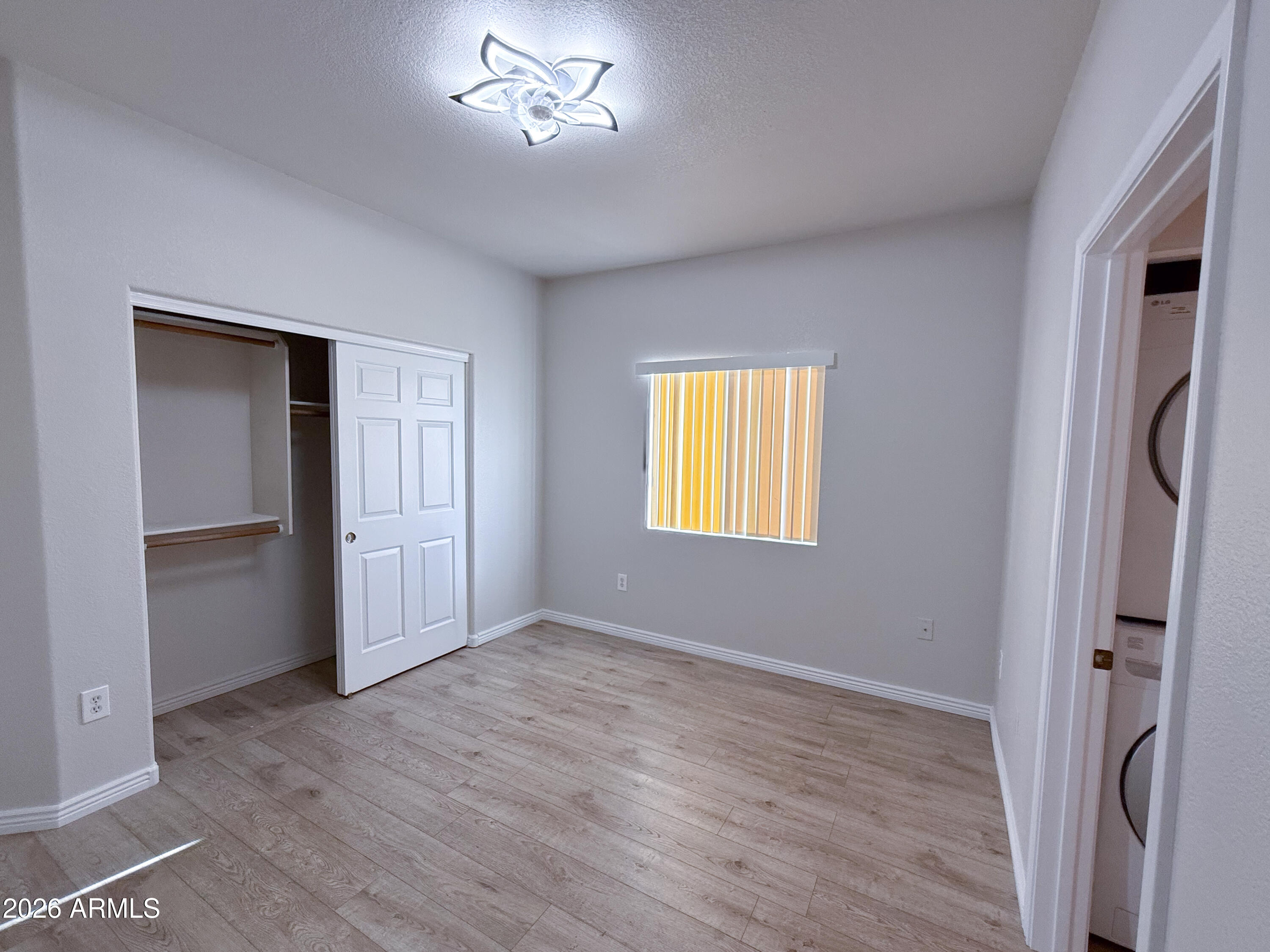 7101 West Beardsley Road, Unit 711 Glendale, AZ 85308 - Photo 25 of 33 a view of an empty room with a window