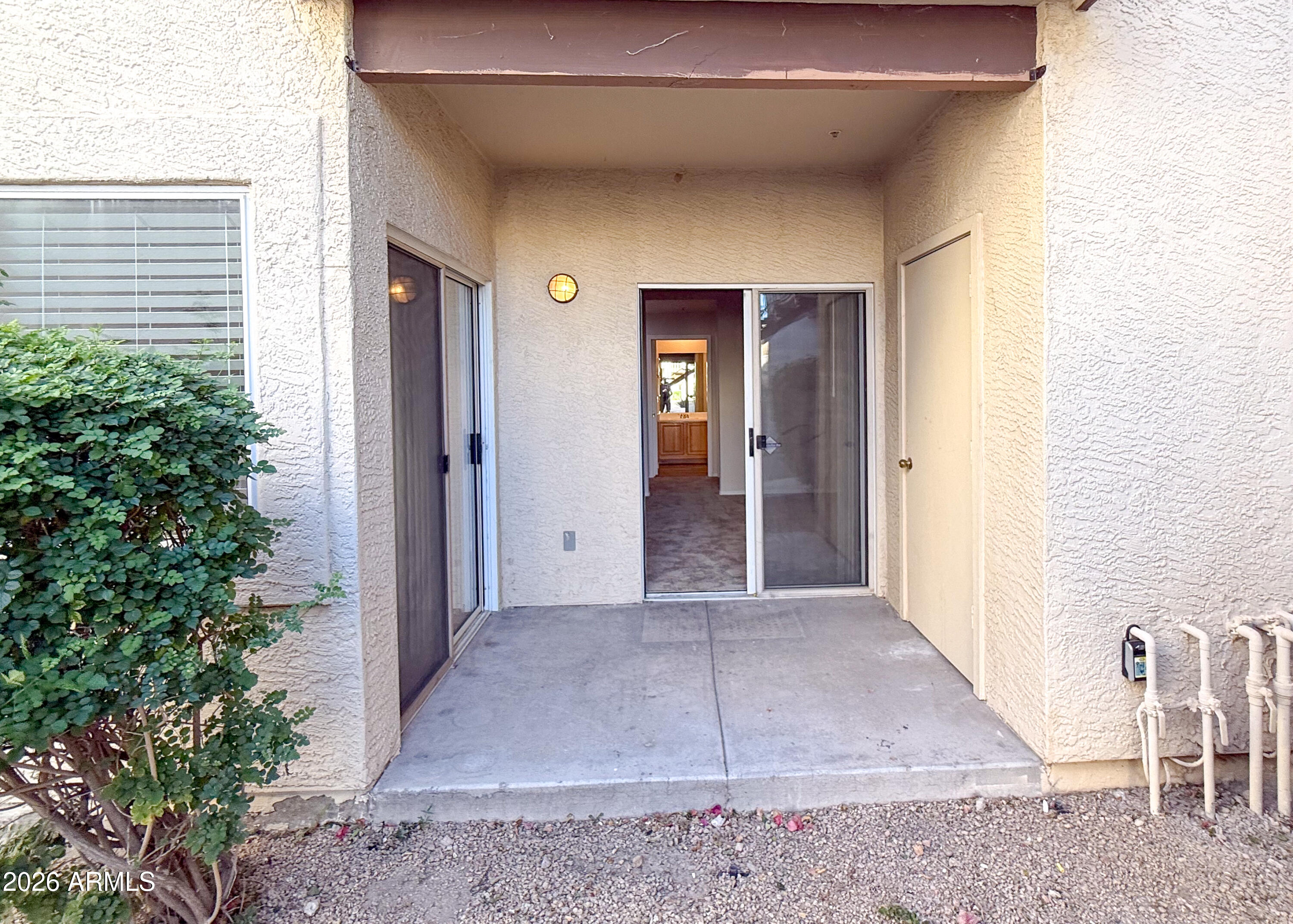 7101 West Beardsley Road, Unit 711 Glendale, AZ 85308 - Photo 29 of 33 a view of a hallway with wooden walls