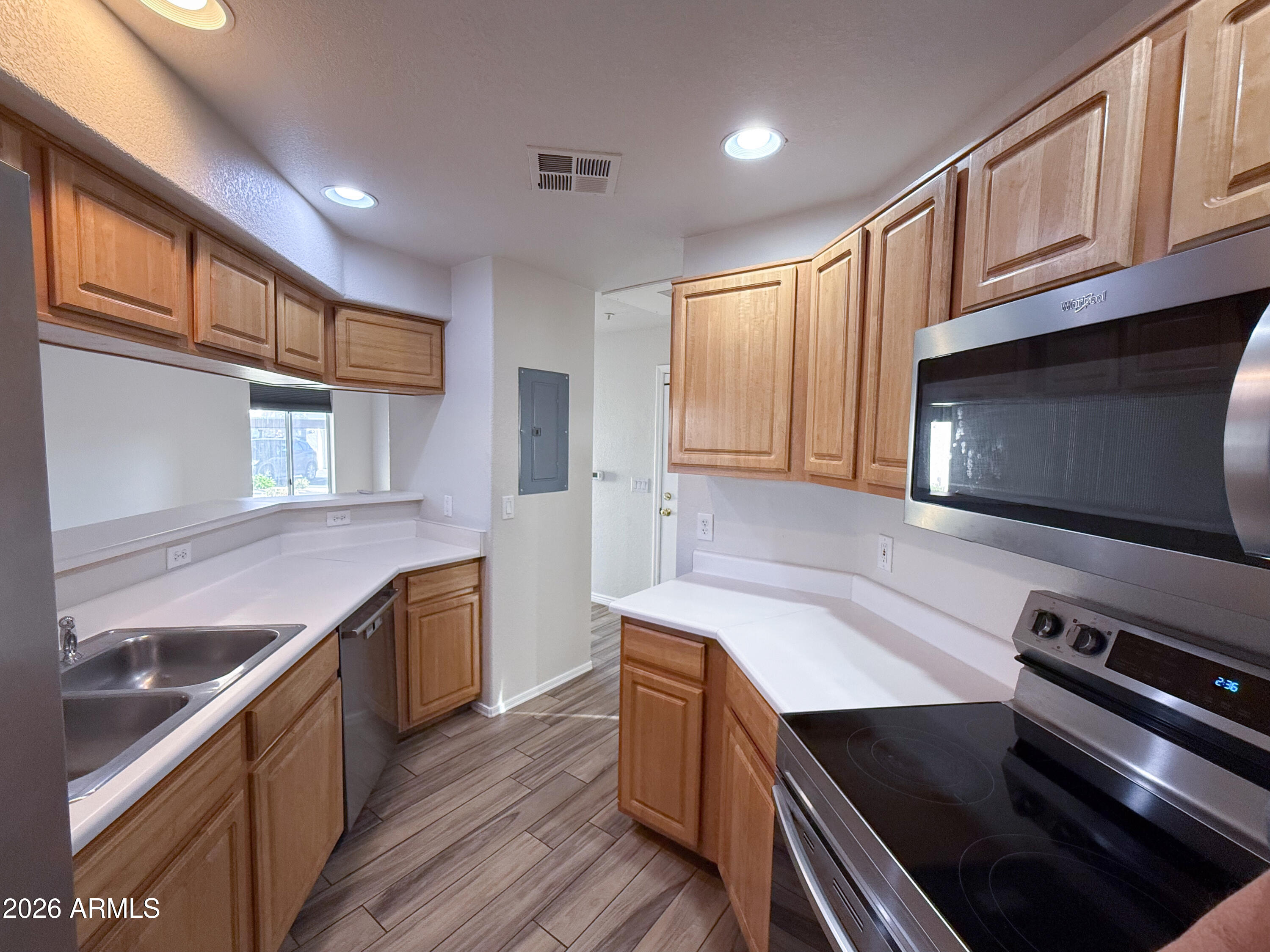 7101 West Beardsley Road, Unit 711 Glendale, AZ 85308 - Photo 4 of 33 a kitchen with stainless steel appliances granite countertop a stove and a sink