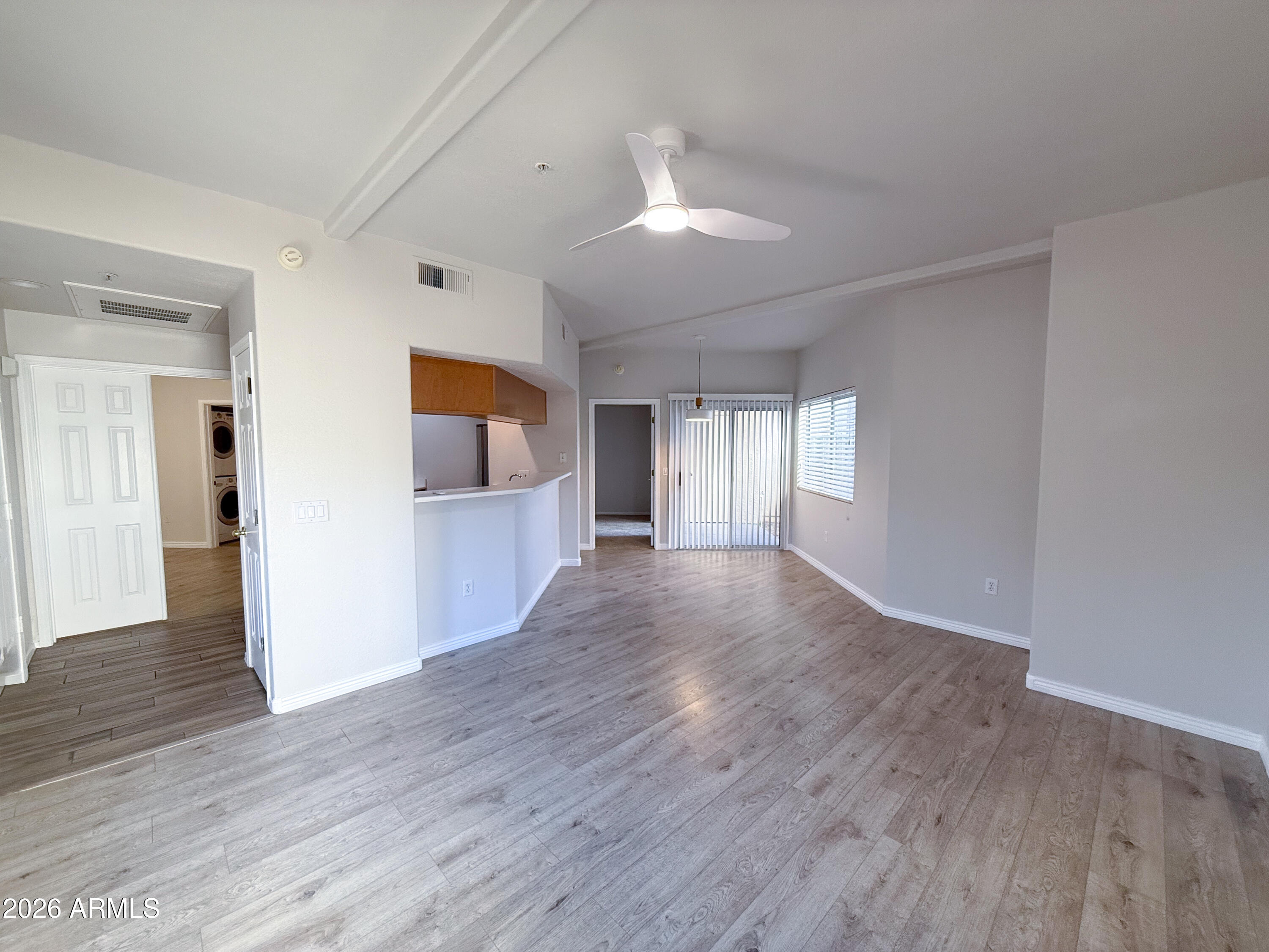 7101 West Beardsley Road, Unit 711 Glendale, AZ 85308 - Photo 5 of 33 a view of a big room with wooden floor and windows