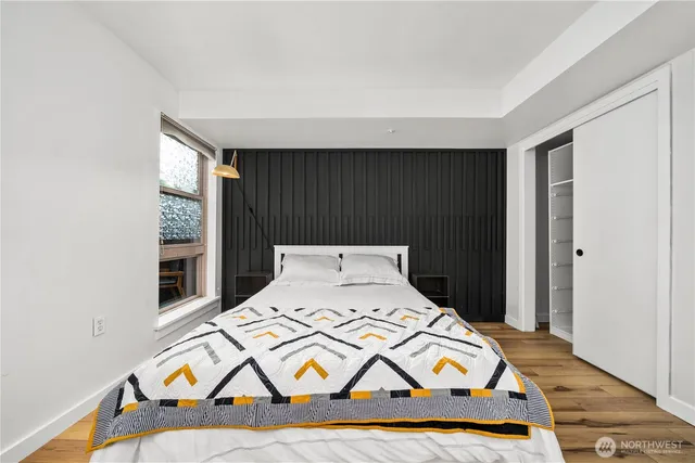 a room with a bed and a window