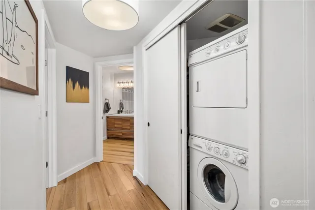 a view of a hallway with washer and dryer