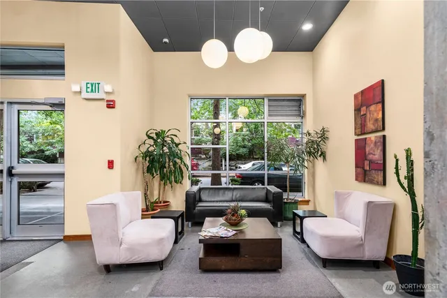a living room with furniture and a large window