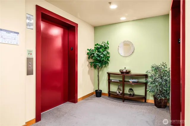 a view of a livingroom with furniture and a potted plant