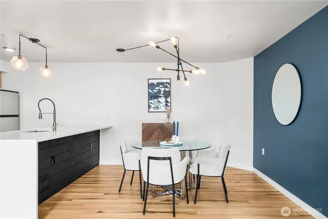 a view of a dining room with furniture and wooden floor