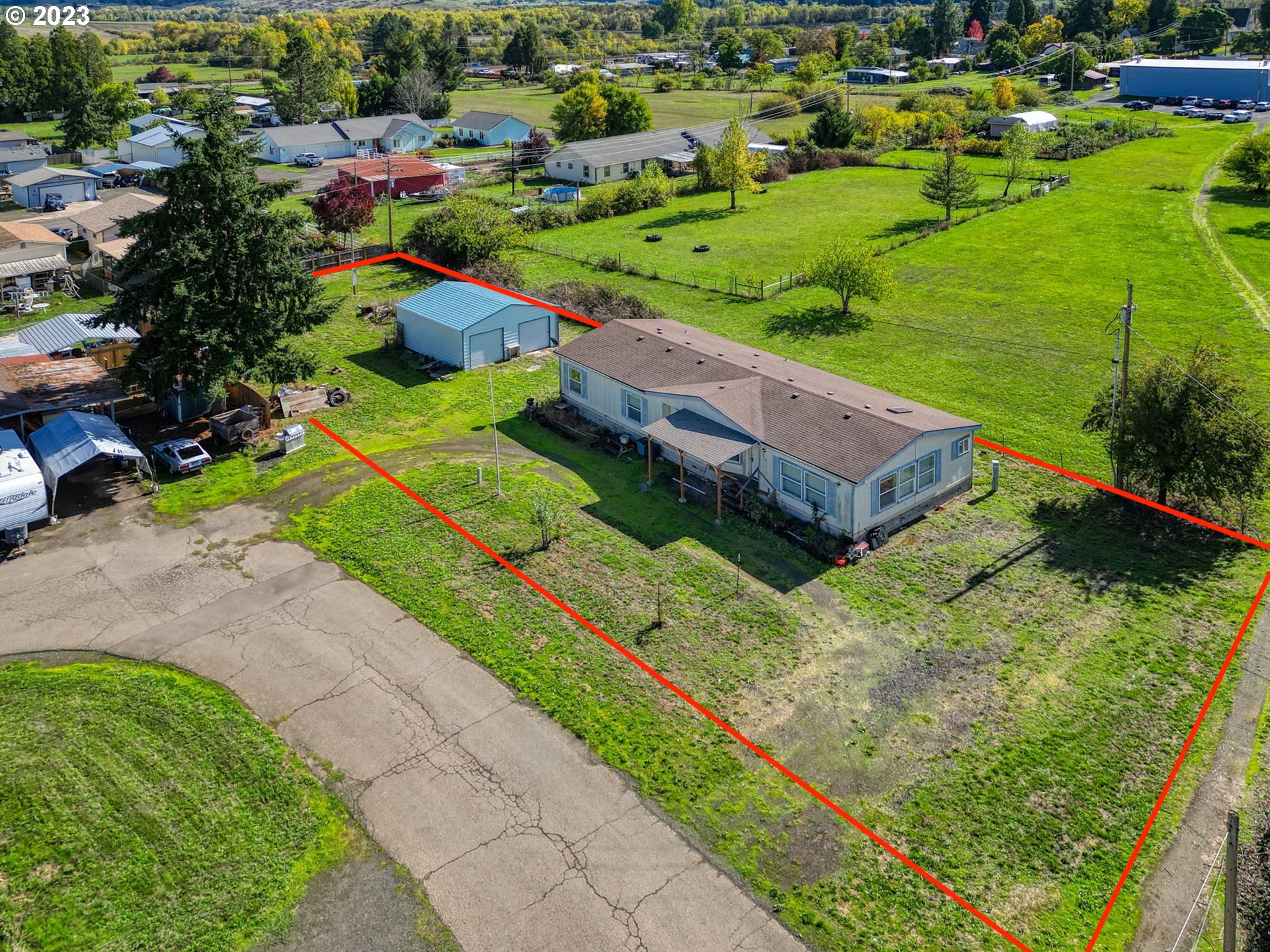 434 Locust Street Yoncalla, OR 97499 - Photo 1 of 36 a view of a garden with a houses