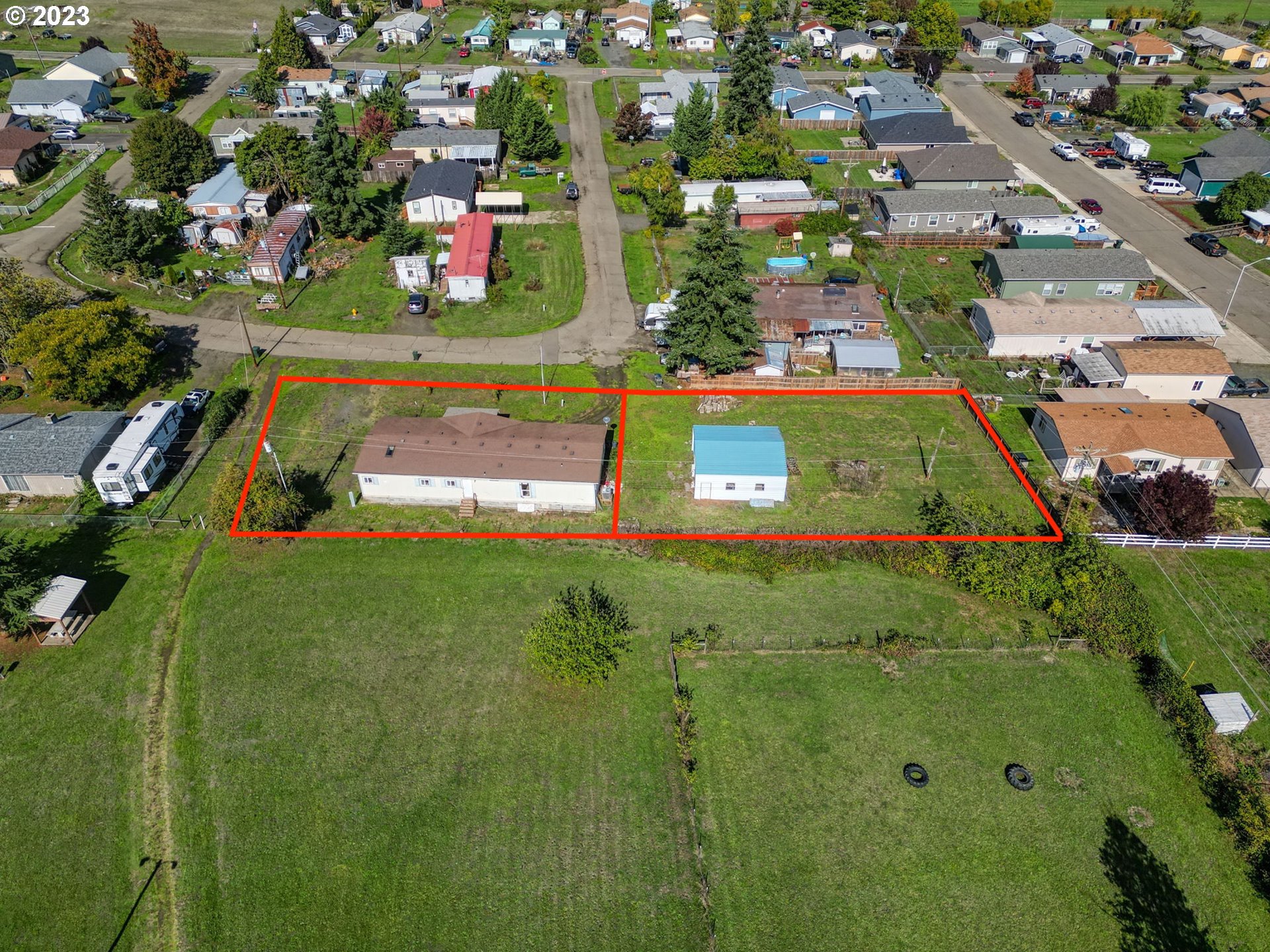 434 Locust Street Yoncalla, OR 97499 - Photo 12 of 36 an aerial view of residential houses with outdoor space and trees