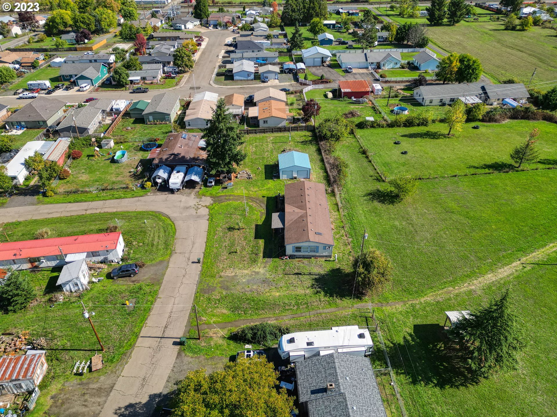 434 Locust Street Yoncalla, OR 97499 - Photo 14 of 36 an aerial view of a houses with a yard
