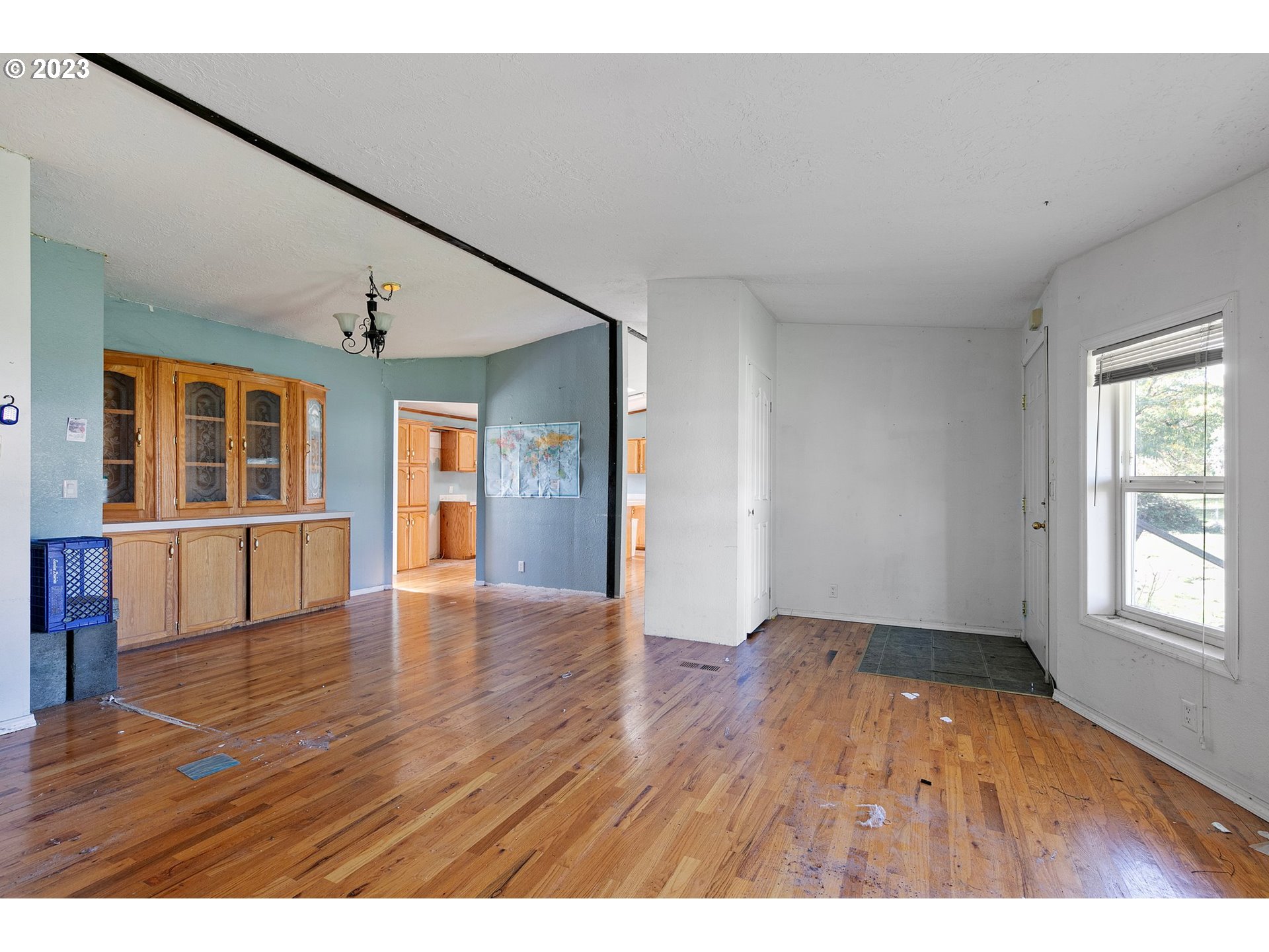 434 Locust Street Yoncalla, OR 97499 - Photo 18 of 36 an empty room with wooden floor and windows