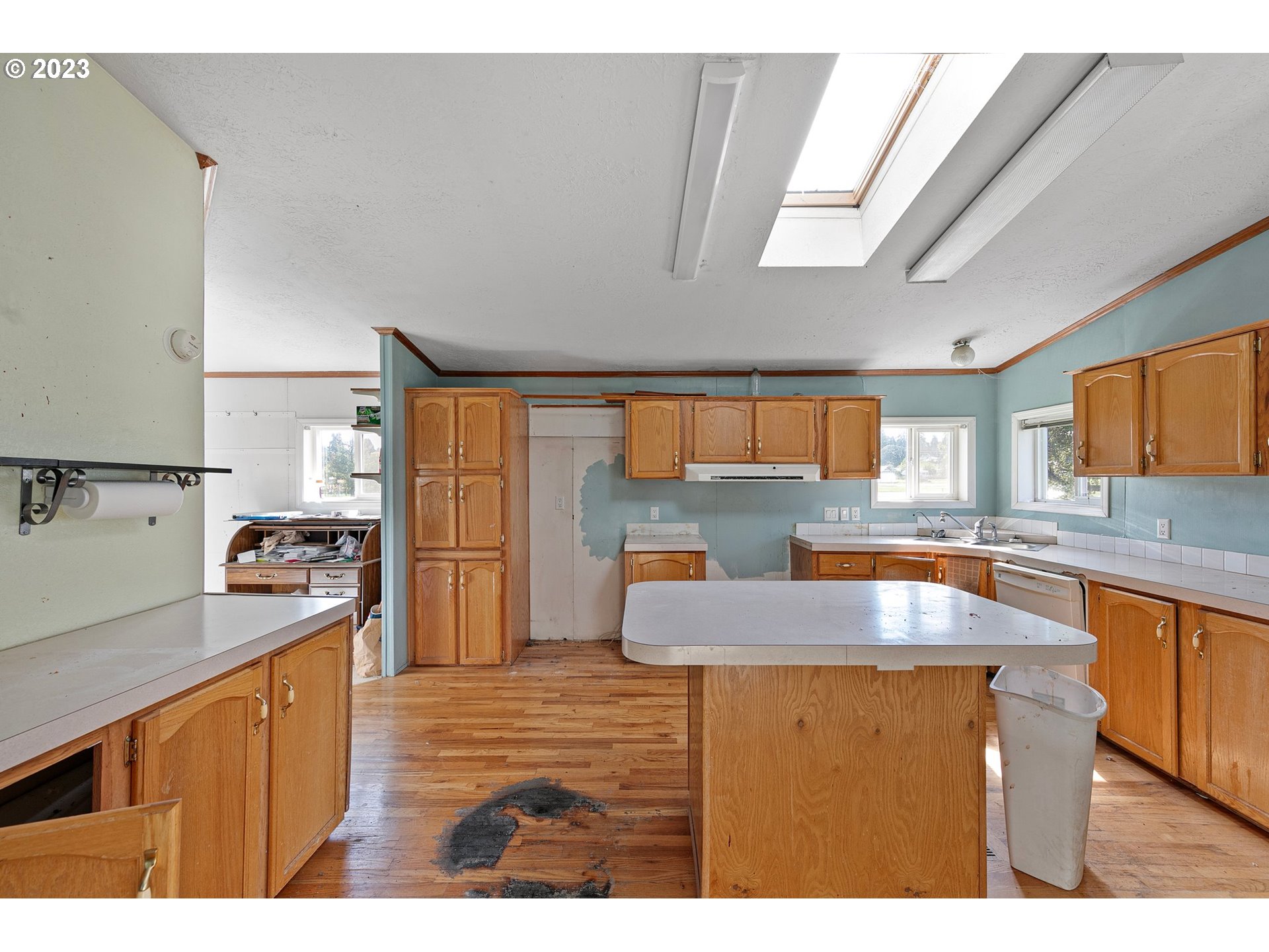 434 Locust Street Yoncalla, OR 97499 - Photo 20 of 36 a kitchen with stainless steel appliances granite countertop a sink a stove counter space and cabinets