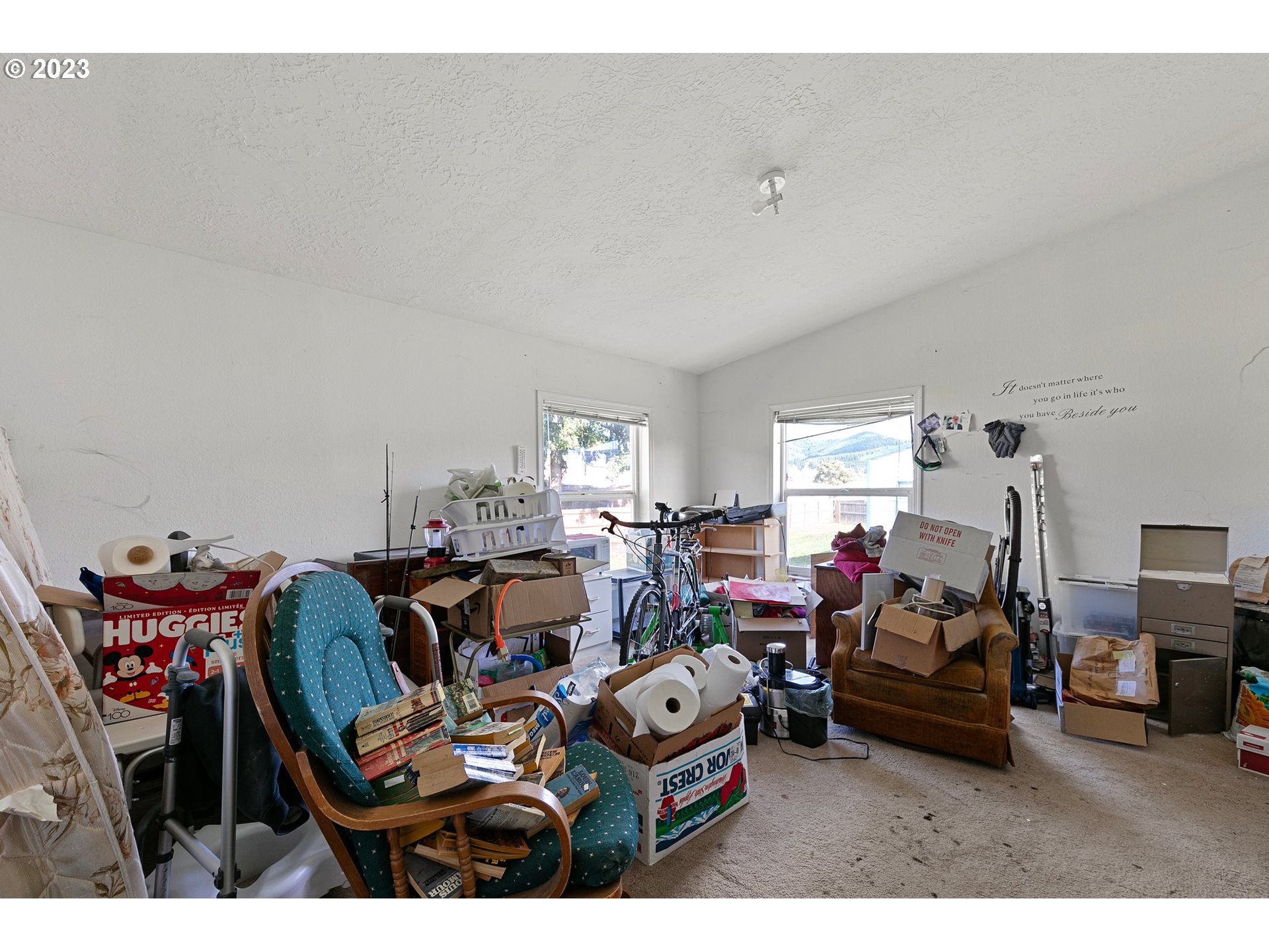 434 Locust Street Yoncalla, OR 97499 - Photo 27 of 36 a living room with lots of furniture and cars