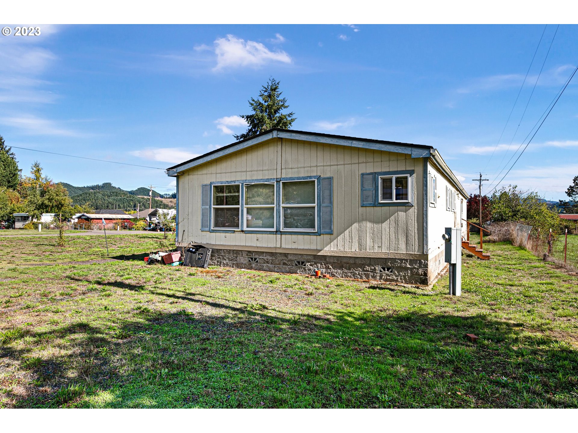434 Locust Street Yoncalla, OR 97499 - Photo 5 of 36 a front view of a house with a yard