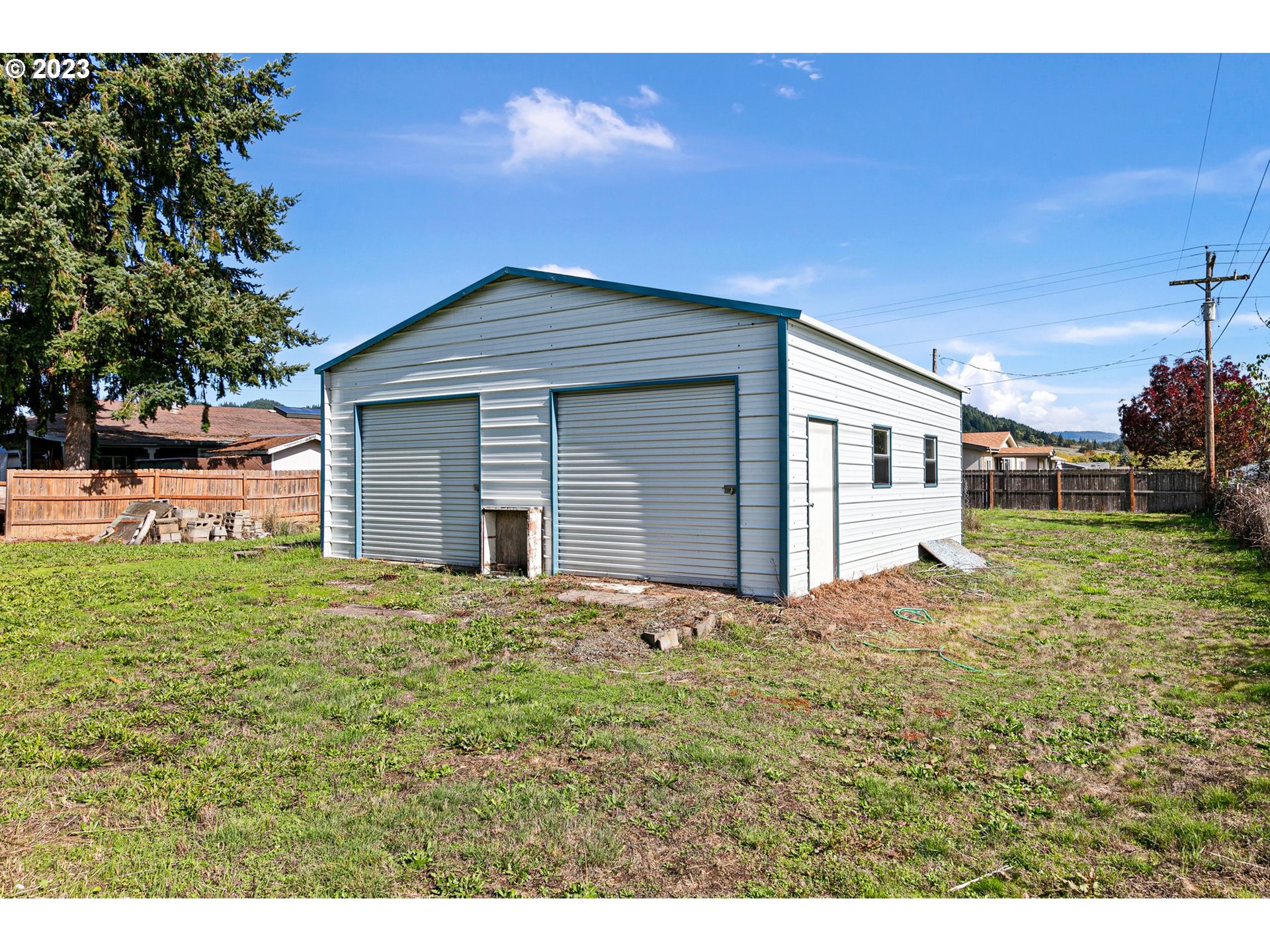 434 Locust Street Yoncalla, OR 97499 - Photo 7 of 36 a house view with a garden space