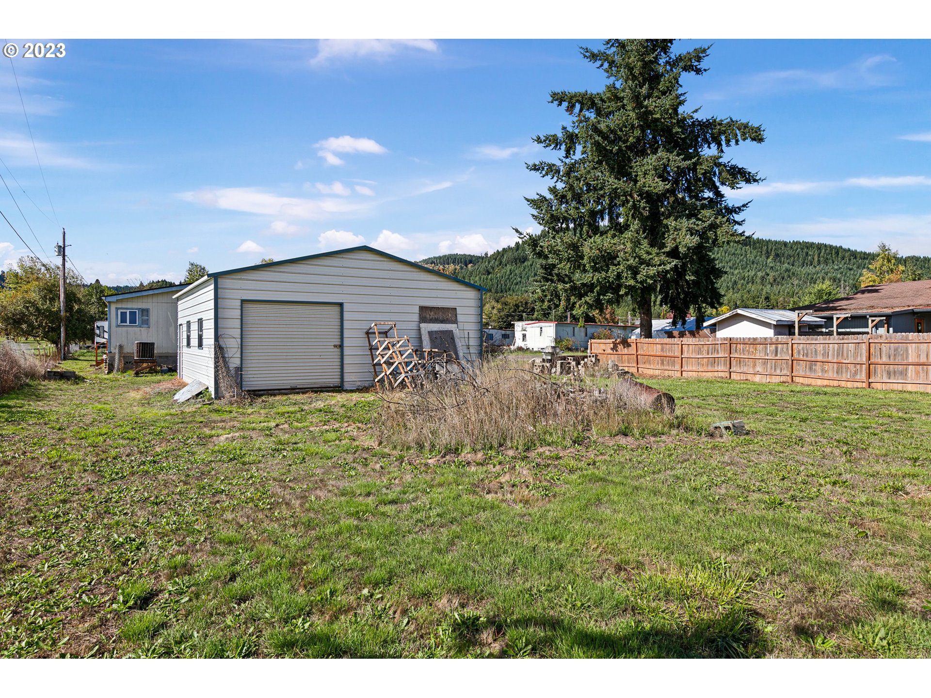 434 Locust Street Yoncalla, OR 97499 - Photo 8 of 36 a view of a house with a yard