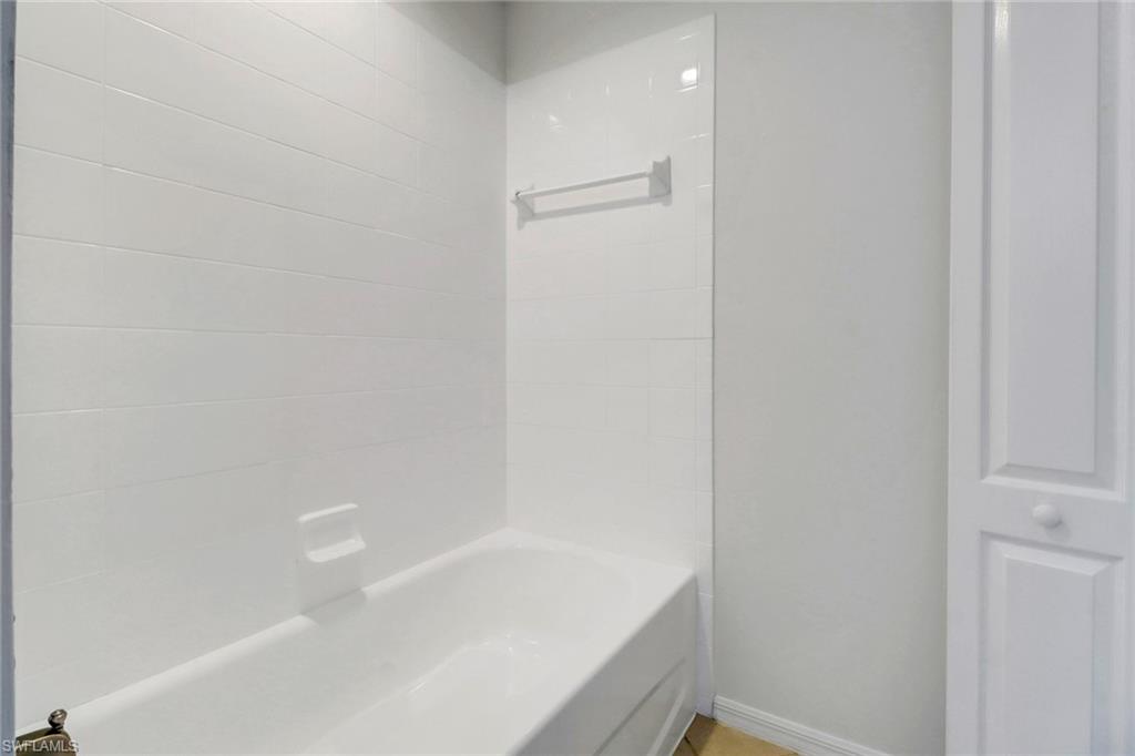 8451 Kingbird Loop, Unit 334 Estero, FL 33967 - Photo 16 of 26 a close up of a bathtub