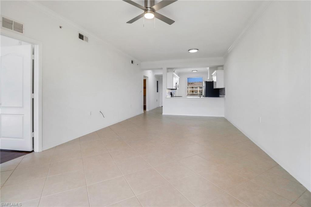 8451 Kingbird Loop, Unit 334 Estero, FL 33967 - Photo 17 of 26 a view of a kitchen with a sink and a refrigerator