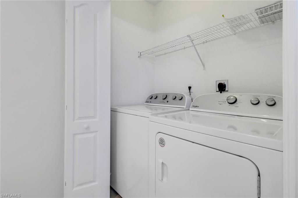 8451 Kingbird Loop, Unit 334 Estero, FL 33967 - Photo 18 of 26 a utility room with dryer and washer