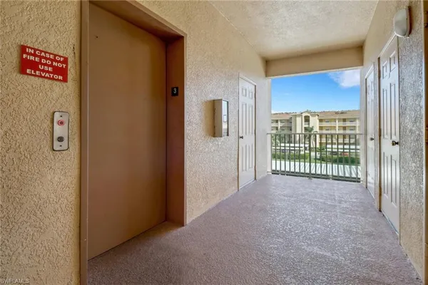a view of a room with large windows