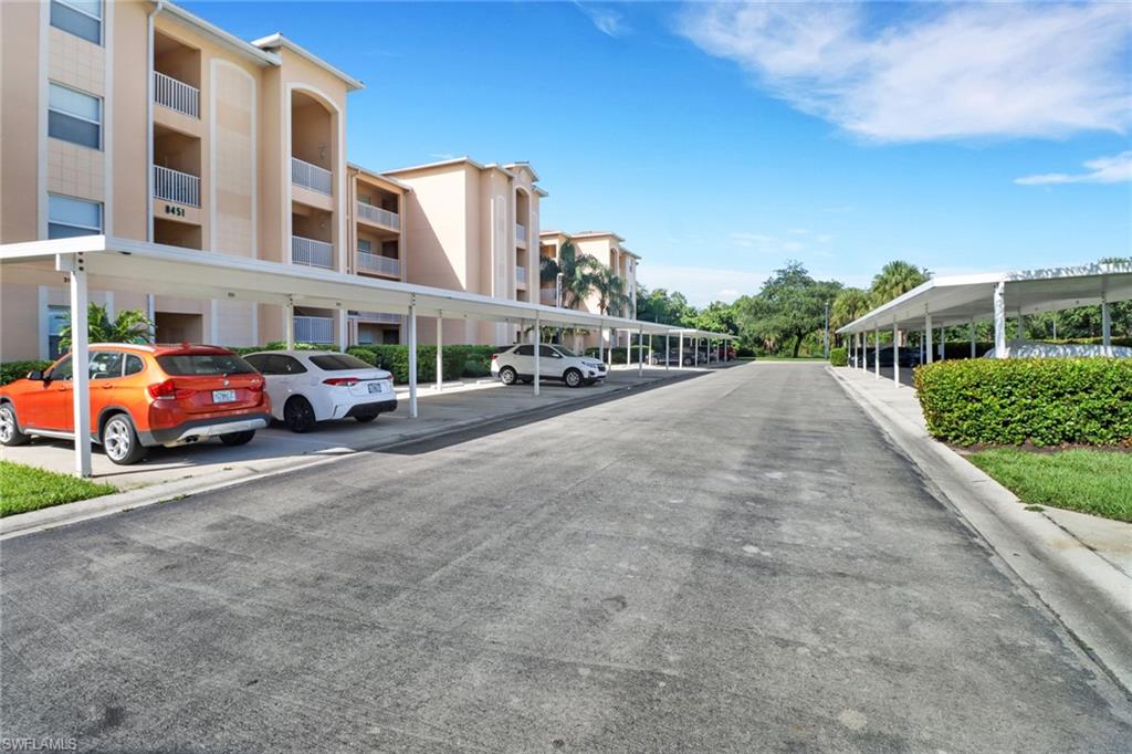 8451 Kingbird Loop, Unit 334 Estero, FL 33967 - Photo 25 of 26 a car parked in front of a building