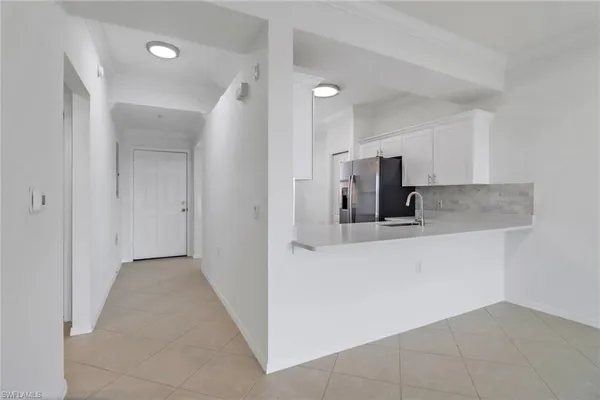 a view of counter top space and stainless steel appliances