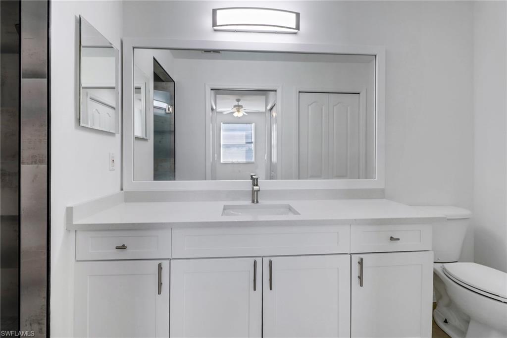 8451 Kingbird Loop, Unit 334 Estero, FL 33967 - Photo 9 of 26 a bathroom with a sink and a toilet