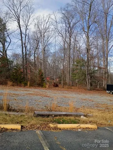 a view of a yard with trees
