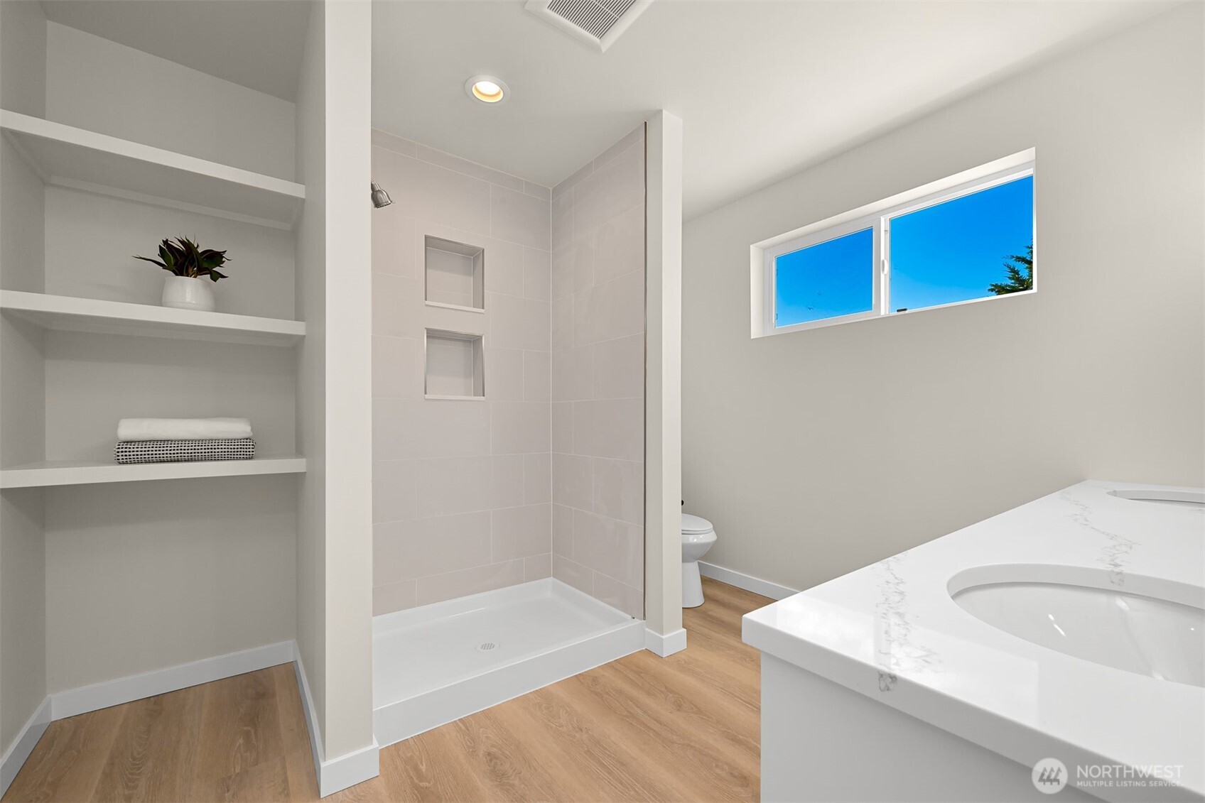710 A F & S Grade Road, Unit B Sedro-Woolley, WA 98284 - Photo 27 of 38 a bathroom with a sink a toilet and shower