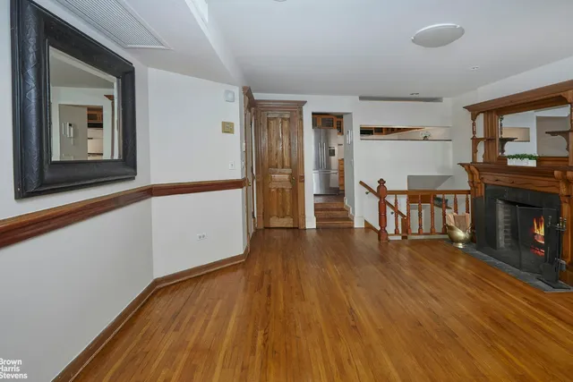 a view of a livingroom with furniture and wooden floor