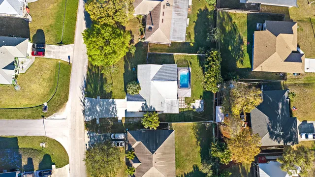 an aerial view of residential houses with outdoor space