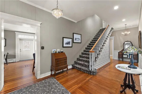 a view of entryway with livingroom and wooden floor