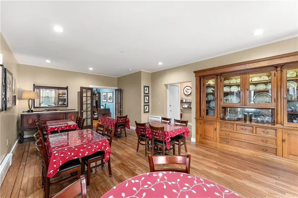 a living room with furniture a wooden floor and a window
