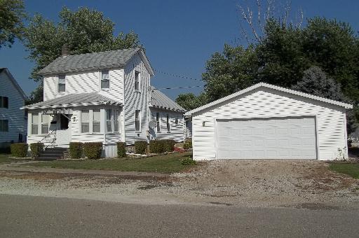 345 Porter Avenue Grand Ridge, IL 61325 - Photo 1 of 14 a front view of a house with a yard and garage