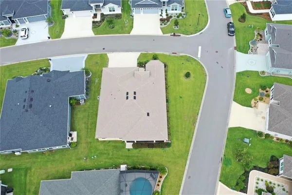 an aerial view of a house with a swimming pool