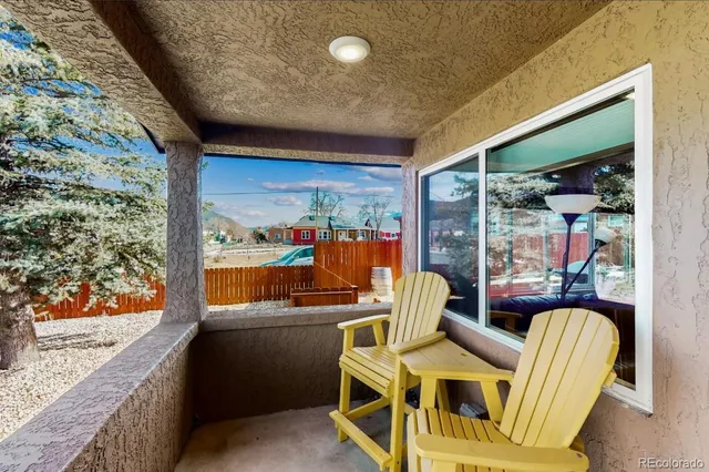 a room with furniture and a large window