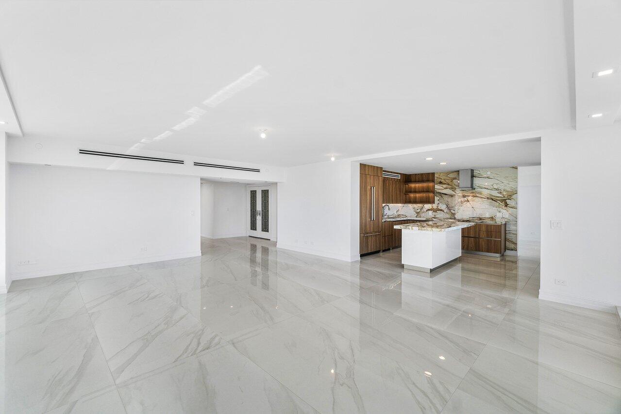 3505 South Ocean Boulevard, Unit 4S Highland Beach, FL 33487 - Photo 11 of 48 a view of a kitchen with a sink and a refrigerator