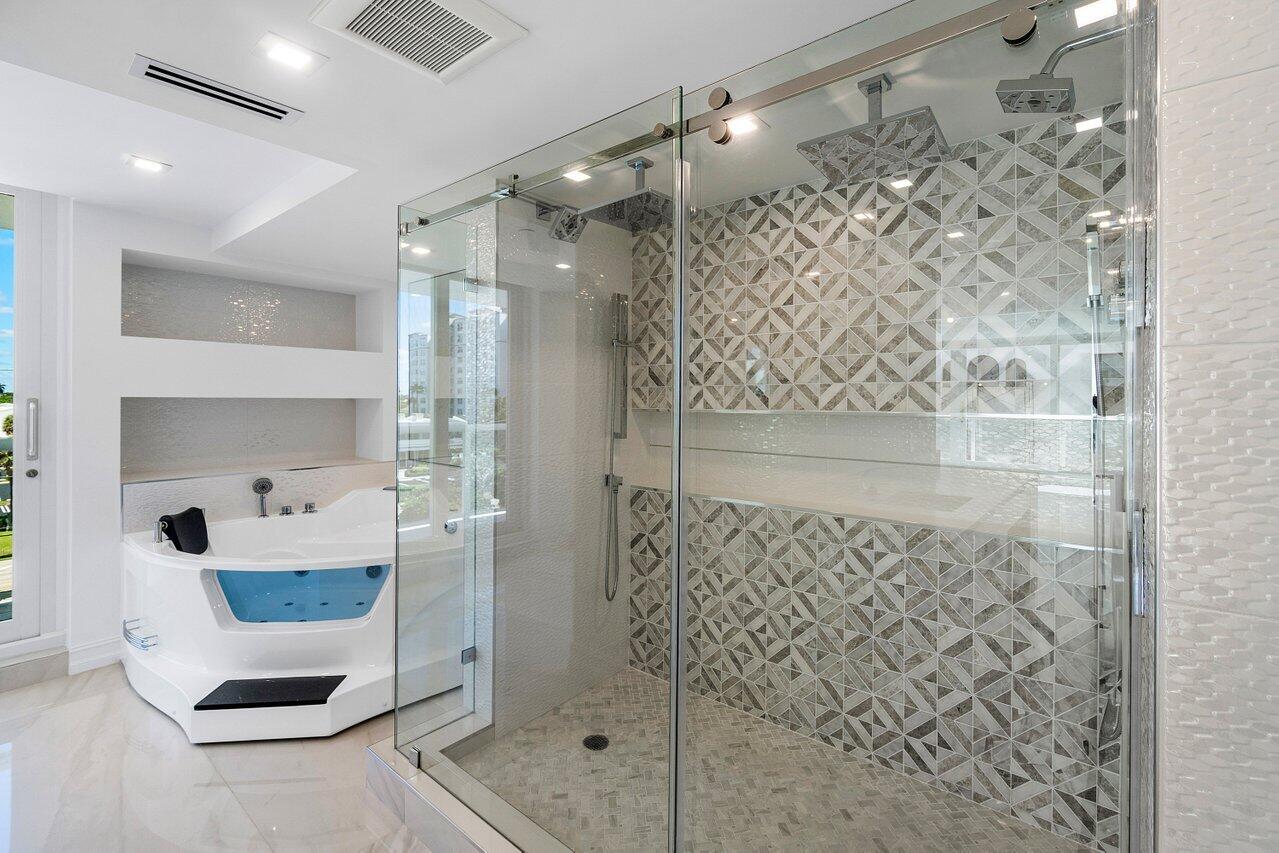 3505 South Ocean Boulevard, Unit 4S Highland Beach, FL 33487 - Photo 33 of 48 a bathroom with a shower