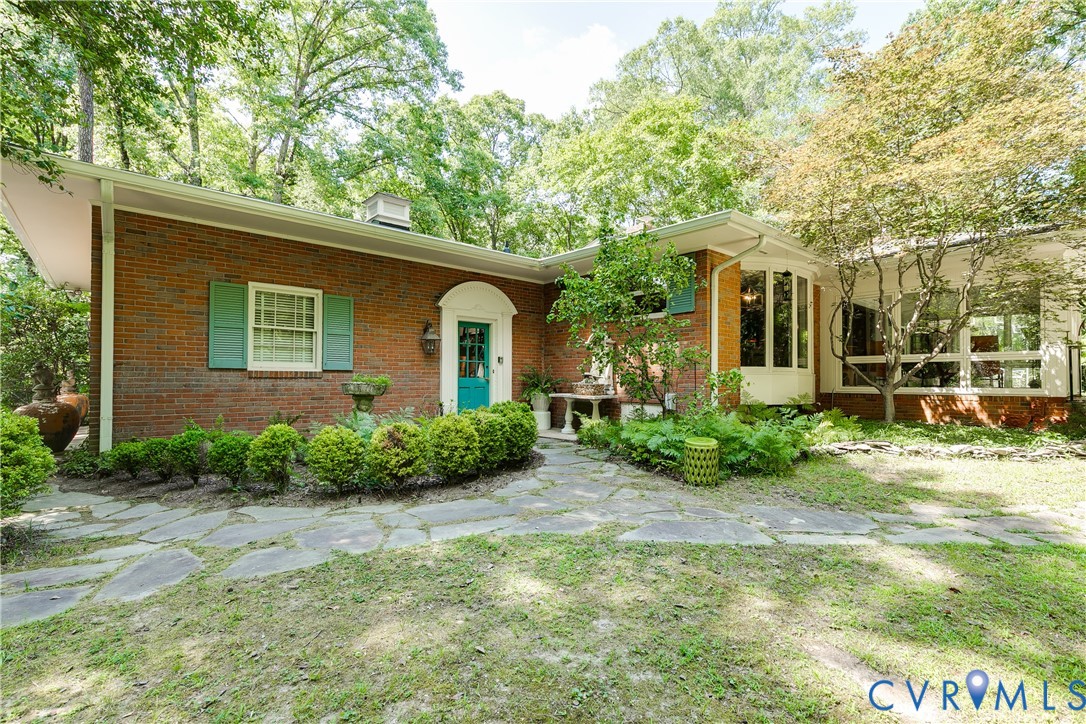 10475 Cherokee Road Richmond, VA 23235 - Photo 43 of 74 Brick exterior with a vibrant turquoise entry door