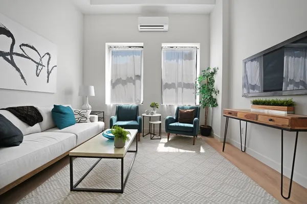 a living room with furniture and a window