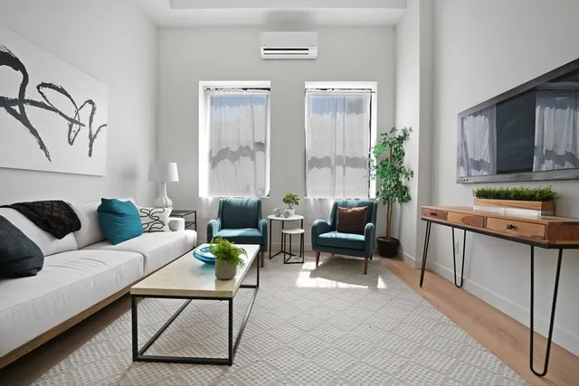 a living room with furniture and a window