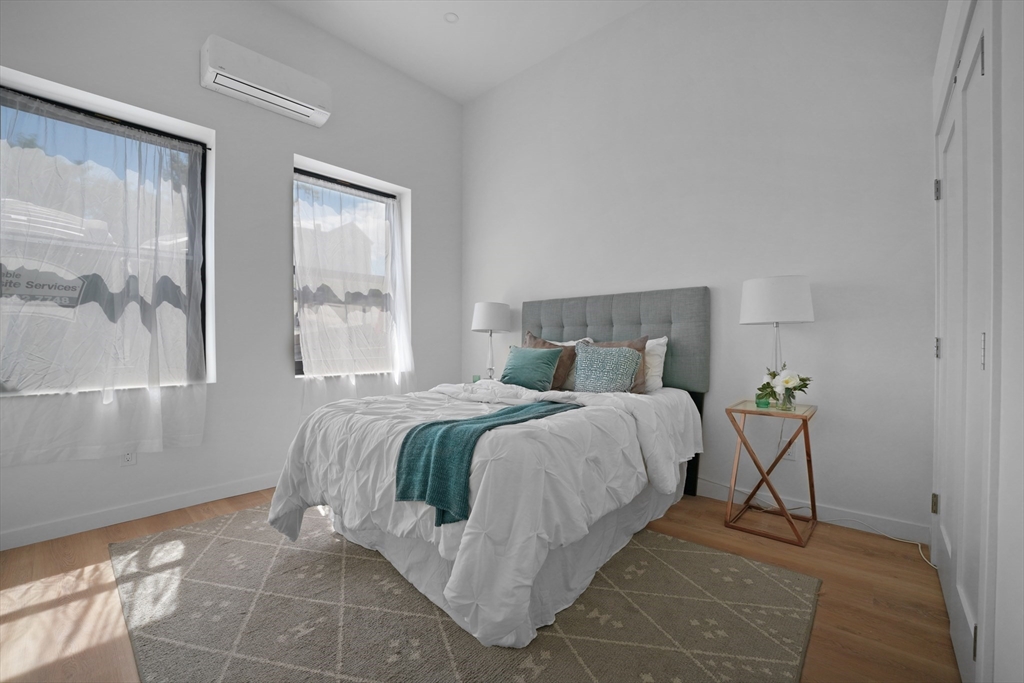 403 Division Street, Unit 11 Fall River, MA 02721 - Photo 21 of 27 a bedroom with a bed and window