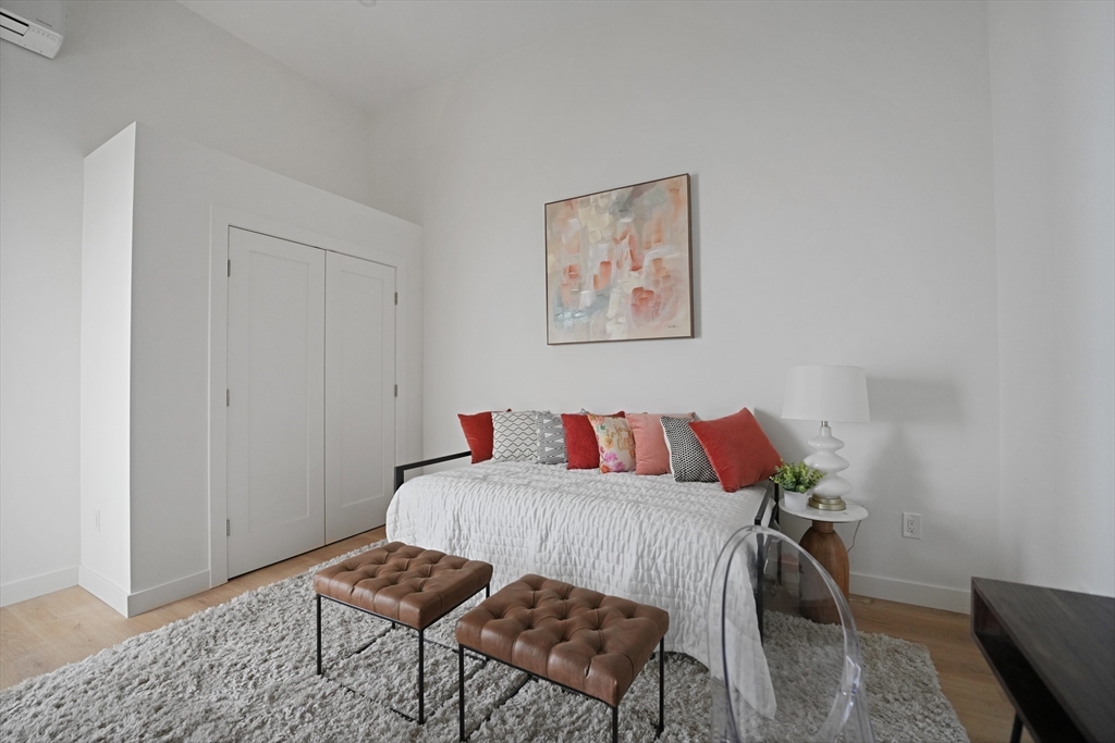 403 Division Street, Unit 11 Fall River, MA 02721 - Photo 25 of 27 a bedroom with a bed and chair