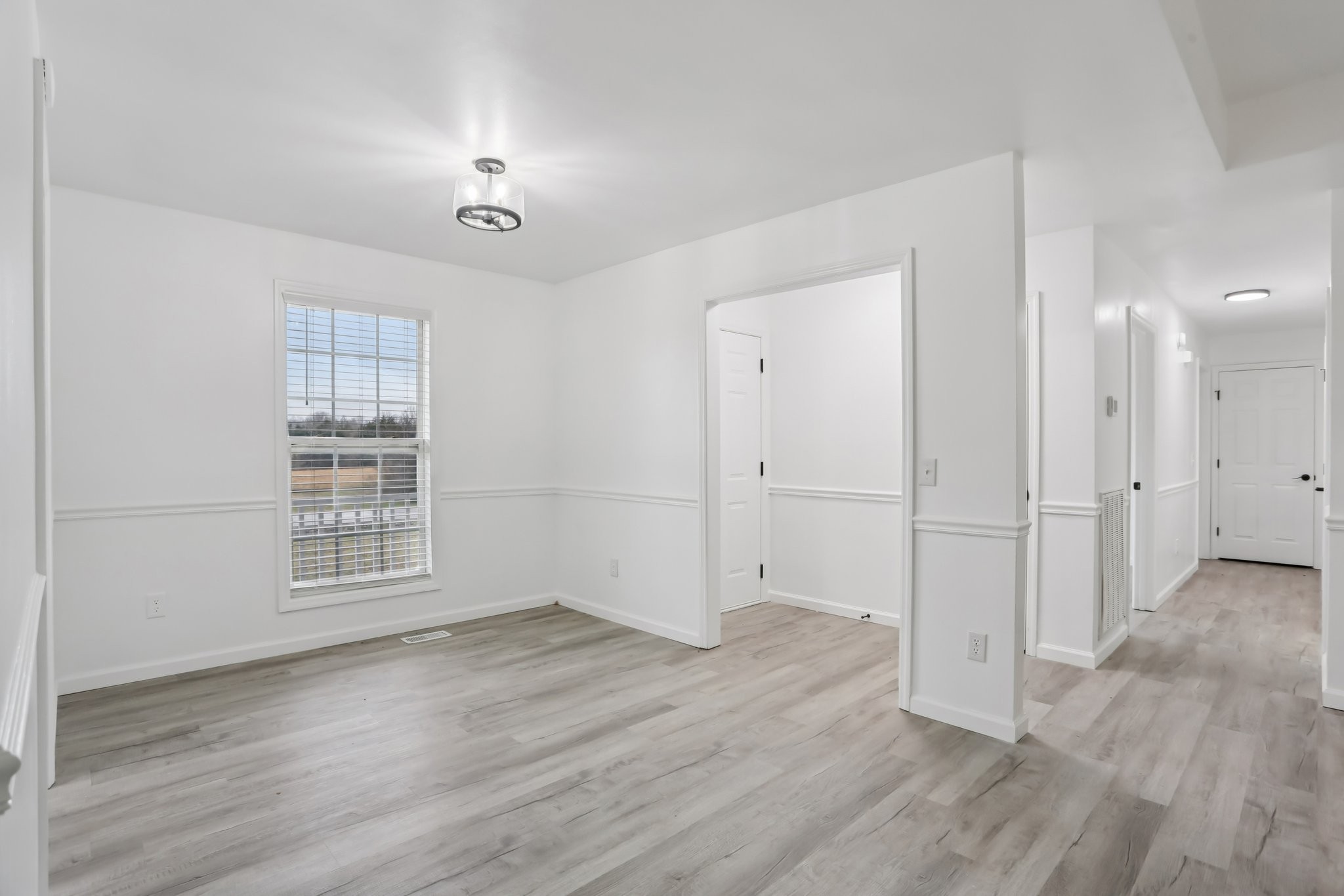 1101 Bugscuffle Road Wartrace, TN 37183 - Photo 11 of 42 wooden floor in an empty room with a window