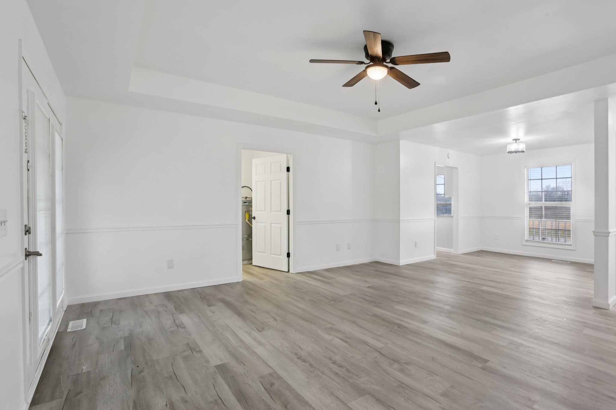 1101 Bugscuffle Road Wartrace, TN 37183 - Photo 13 of 42 an empty room with wooden floor and ceiling fan