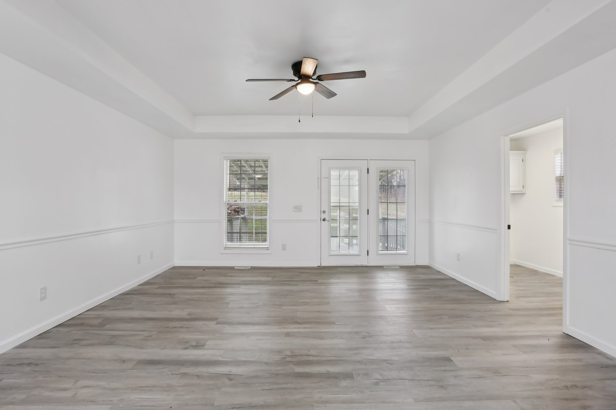 1101 Bugscuffle Road Wartrace, TN 37183 - Photo 15 of 42 a view of an empty room with wooden floor and a window