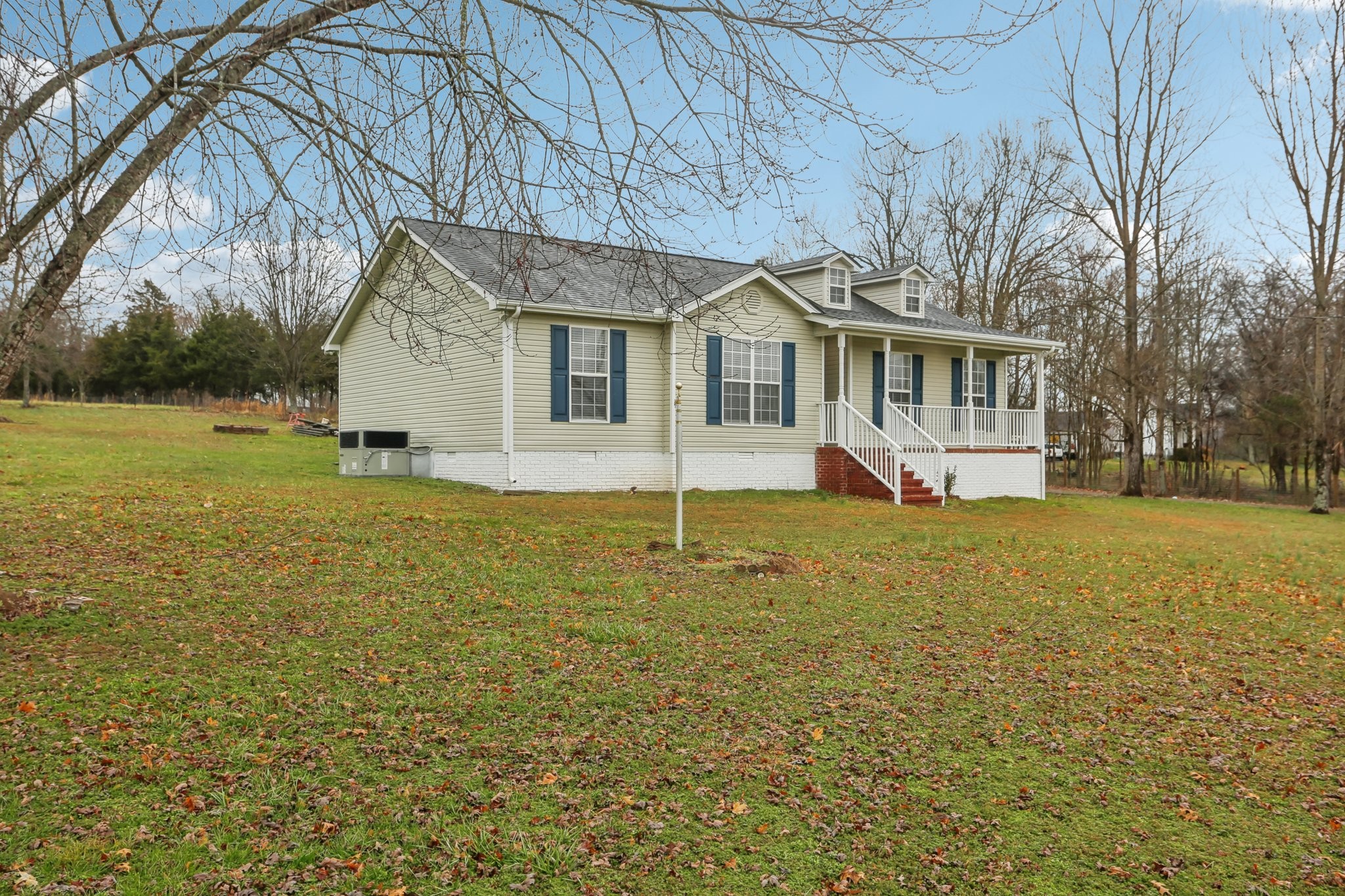 1101 Bugscuffle Road Wartrace, TN 37183 - Photo 2 of 42 a front view of house with yard and trees around
